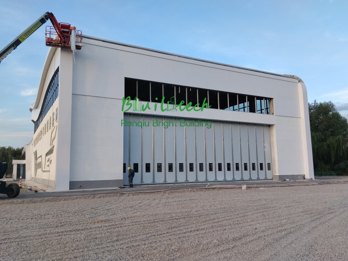 Custom Side Sliding Hangar Door: 18m × 6m Solution for Limited Headroom | Bright Building