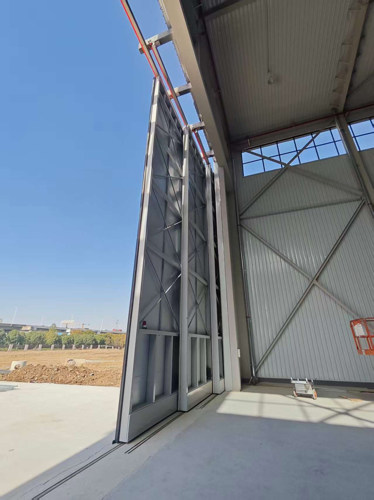 Large-scale drone hangar door