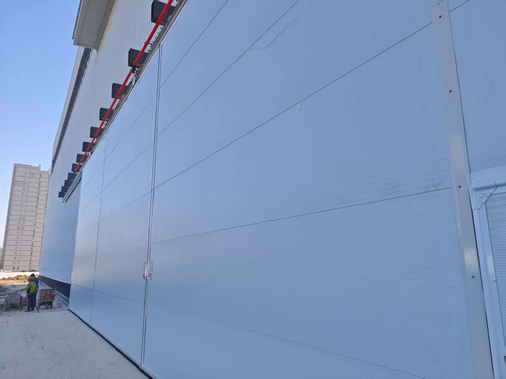 Large-scale drone hangar door