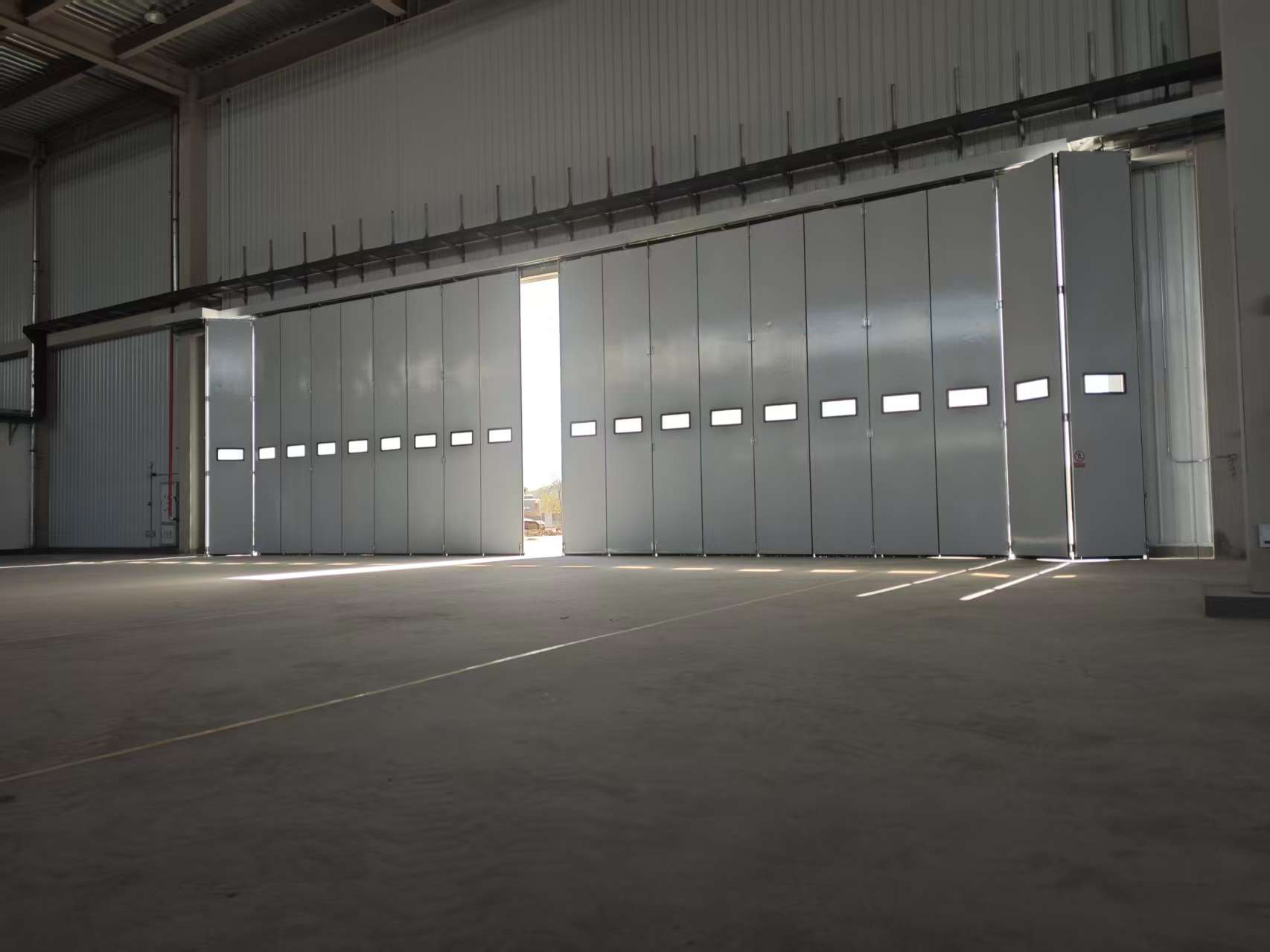 Large-scale drone hangar door