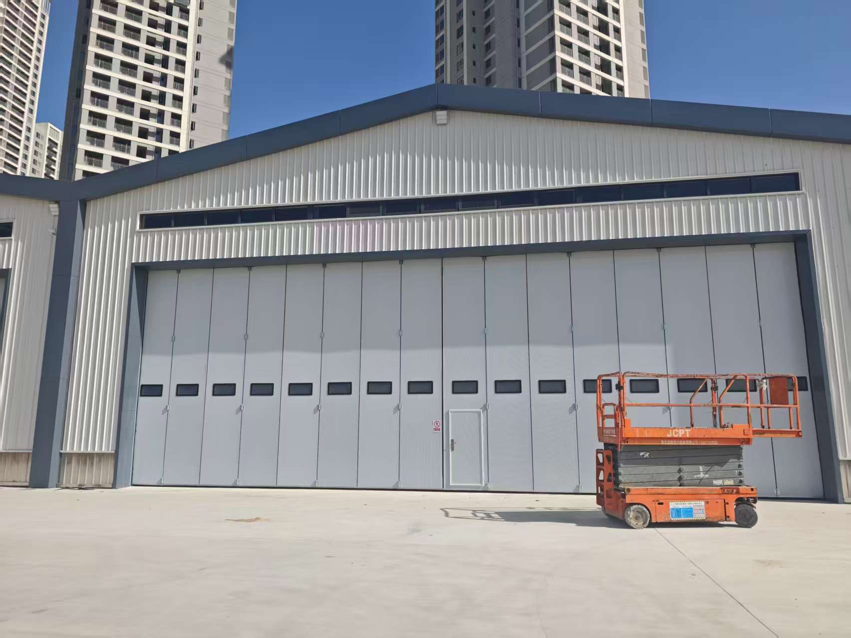 Large-scale drone hangar door