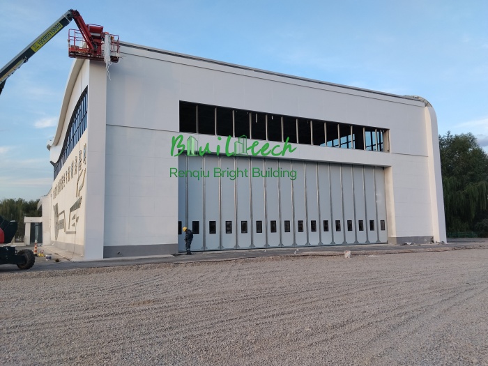 Custom Side Sliding Hangar Door: 18m × 6m Solution for Limited Headroom | Bright Building